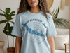 Light blue t-shirt with "Theodore Roosevelt Lake Arizona" and a blue lake map over a compass.