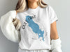White t-shirt with Gull Lake, Michigan shape and compass design.