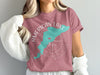 Teal map outline on pink t-shirt with "American Lake Washington" text and compass rose.