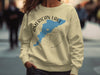 Light yellow crewneck sweatshirt with American Lake Washington map and compass design.