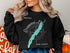 Black sweatshirt featuring Greenwood Lake, New Jersey map and compass design.