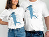 White t-shirts with Lynx Lake Arizona design featuring a blue lake outline and compass.