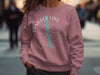 Rose pink sweatshirt with "Hemlock Lake New York" compass graphic.