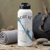 White water bottle with black lid, compass, and "BOAT KEY" graphic, beside rolled towel.