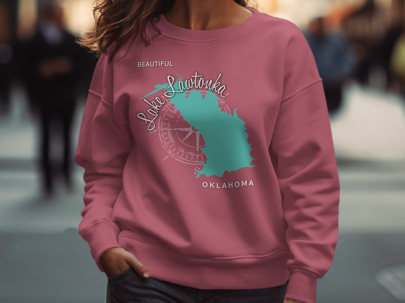Pink sweatshirt with teal Lake Lawtonka, Oklahoma map and compass graphic.