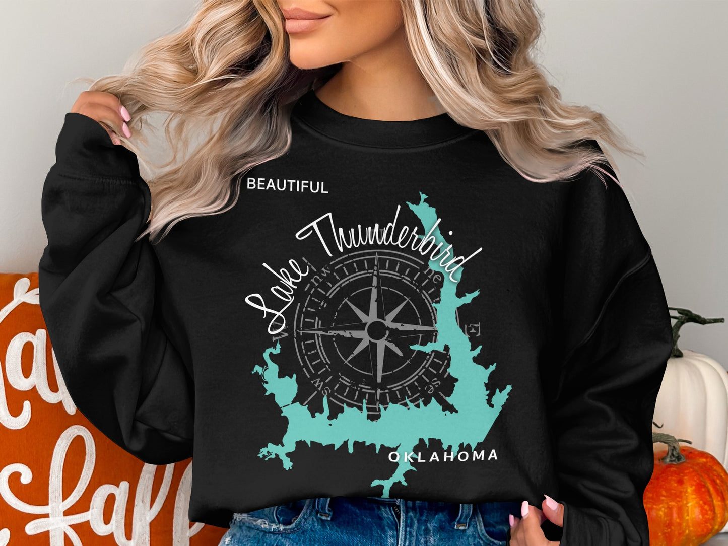 Black sweatshirt with turquoise Lake Thunderbird map and compass graphic.