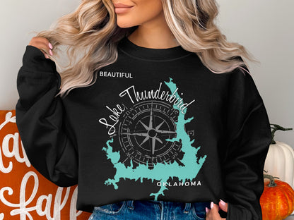 Black sweatshirt with turquoise Lake Thunderbird map and compass graphic.
