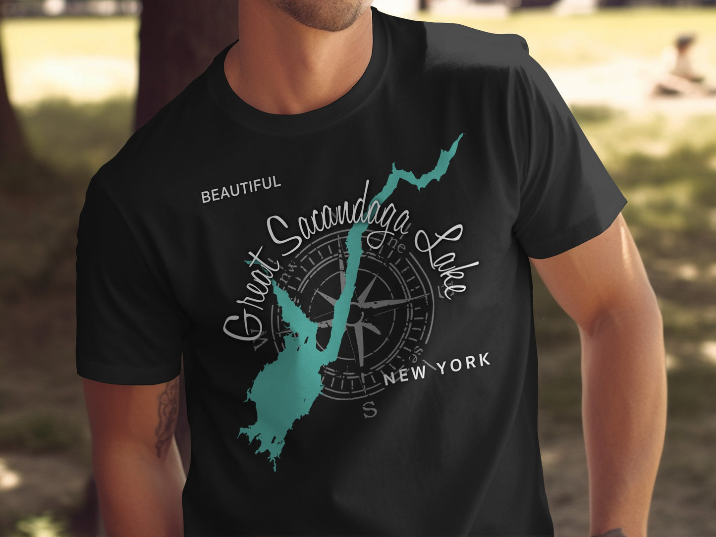 T-shirt with teal map of Great Sacandaga Lake and compass.
