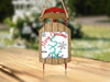 Christmas ornament shaped like a sled with text "Merry Christmas from Lake Fort".