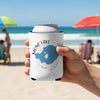 White can koozie with Mono Lake California map design held on a beach.