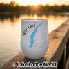 A white stainless steel wine tumbler with a map of Yale Lake, Washington rests on a wooden dock at sunset.