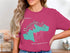 Pink t-shirt with a teal outline map of Merrymeeting Lake, New Hampshire.