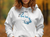 White hoodie with a blue Spoon Lake, Illinois map design and compass rose.