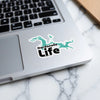 Dardanelle Life sticker on a laptop with a blue lake outline.