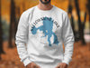 White sweatshirt with blue Yellowstone Lake graphic and compass design.