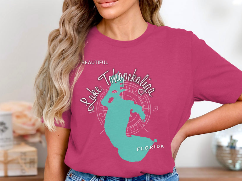 Teal Lake Tohopekaliga Florida graphic on a pink t-shirt.