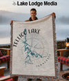 Man holding a Tellico Lake blanket with compass and Tennessee outline.
