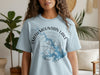 Light blue t-shirt with Smith Mountain Lake Virginia compass graphic and map outline.
