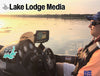 Man in boat with fishing electronics and "Lake Lodge Media" overlay.
