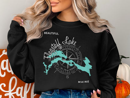 Black crewneck sweatshirt with "Beautiful Flagstaff Lake" and Maine map graphic.