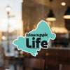 Mascauppic Life sticker on glass, with text © Lake Lodge Media LLC.