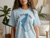 Light blue t-shirt with Long Pond Lake New Hampshire design and compass graphic.