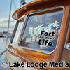 Fort Loudoun Life decal on a wooden boat window, with "Lake Lodge Media" text.