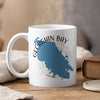 White mug with blue Georgian Bay map and compass design, emitting steam.