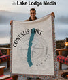 Conesus Lake New York map woven throw blanket held by smiling man.