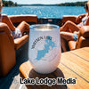 A white insulated wine tumbler with a Watson Lake Arizona graphic sits on a wooden boat table.