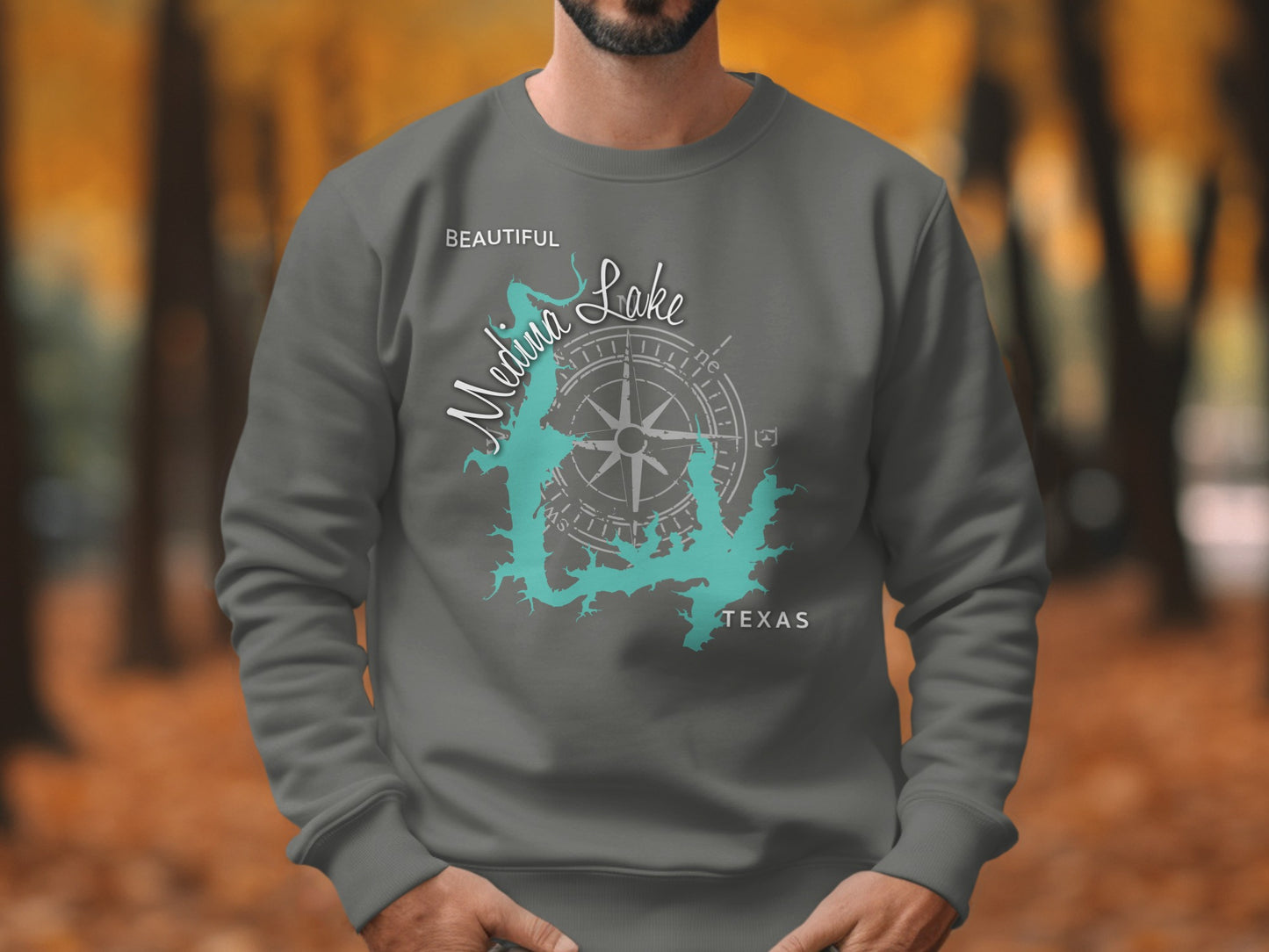 Gray sweatshirt with Medina Lake map and compass design.