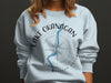 Light blue sweatshirt with Lake Okanagan and British Columbia map graphic.