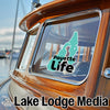 Teal Payette Life sticker on a boat window with Lake Lodge Media text below.