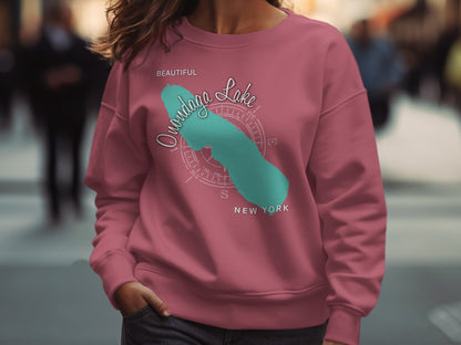 Pink sweatshirt with Onondaga Lake graphic and compass rose.