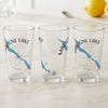 Three glasses with Maligne Lake map and compass designs and "Canada" text.