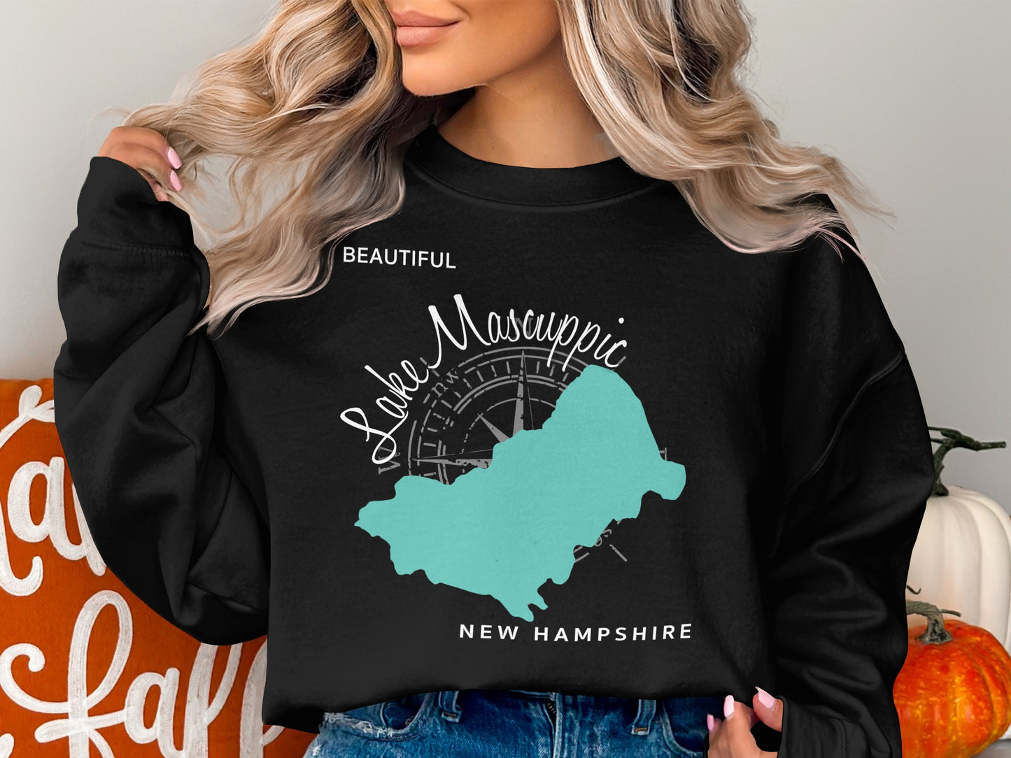 Black sweatshirt with teal map of Lake Winnipesaukee, New Hampshire.