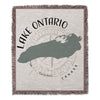 Lake Ontario map with compass and text on a fringed woven throw blanket.
