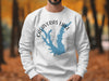White sweatshirt with Calaveras Lake, Texas map graphic and compass rose.