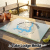 Glass cutting board featuring a blue map of Lake Thunderbird over a compass rose design on a wooden table.