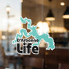D'Arbonne Life decal with a teal lake outline and black text against a window.