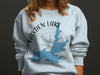 Light blue sweatshirt with Hayden Lake Idaho map and compass design.