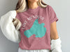 Rose t-shirt with teal Lake Mendota map graphic and "Lake Mendota Wisconsin" text.