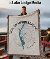Fringe throw blanket with Lake Memphremagog map and compass design.