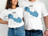 White t-shirts show Pearl Lake Wisconsin map with compass graphic.