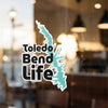 Toledo Bend Life text with a teal map cutout replacing the letter 'O' and 'i'.
