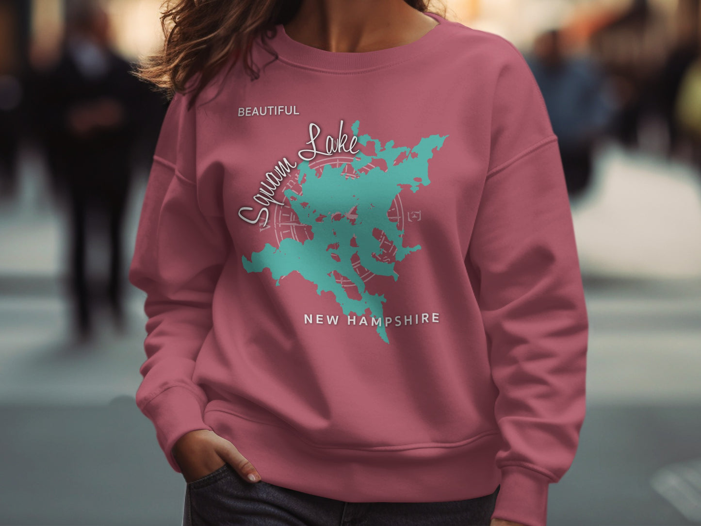 Squam Lake, New Hampshire graphic on pink sweatshirt.