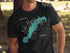 Black t-shirt with teal map of Lake Marble Falls, Texas and compass rose.