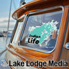 Turquoise "Indian Life" sticker on a boat window, with "Lake Lodge Media" text below.