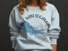 Light blue crewneck sweatshirt with Lake Kabetogama Minnesota map and compass design.