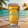 Glass of beer with "Chautauqua Lake" and Tennessee map design on a beach.